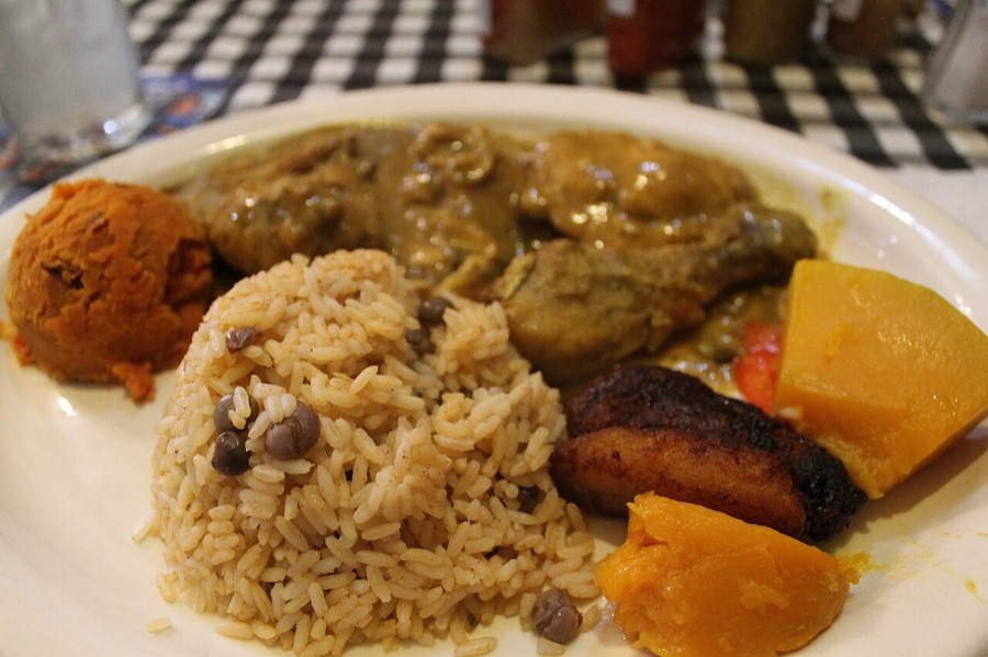 Caribbean curried chicken plate with rice and plantain