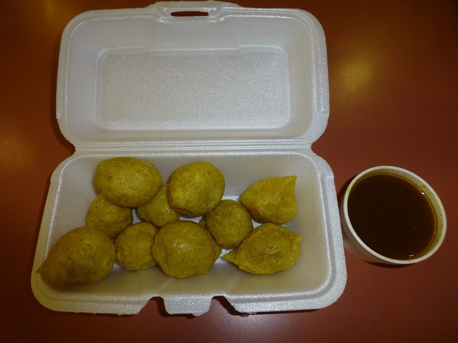 Golden pholourie with tamarind dipping sauce